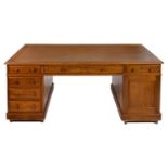 A MAHOGANY PARTNER'S DESK, EARLY 20TH C with tooled leather inlet top and fitted with moulded