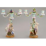 A PAIR OF MEISSEN FLORAL ENCRUSTED CANDELABRA, LATE 19TH C  of two lights, the candlesticks set with