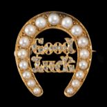 A VICTORIAN DIAMOND, SPLIT PEARL AND GOLD GOOD LUCK HORSESHOE BROOCH, C1875 24mm, lozenge shaped