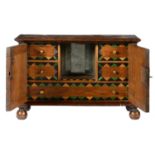 MINIATURE FURNITURE.   A WALNUT AND GEOMETRIC LINE INLAID TABLE CABINET the architectural fitted