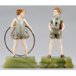 HOOP GIRL AND SONNY BOY.  A PAIR OF PATINATED   BRONZE AND CARVED IVORY FIGURES BY FERDINAND PREISS,