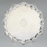 A GEORGE III SILVER SALVER engraved with initials AC and crest in moulded border with shells at