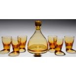 A WHITEFRIARS AMBER GLASS SHERRY DECANTER, STOPPER AND SIX WINE GLASSES DESIGNED BY BARNABY