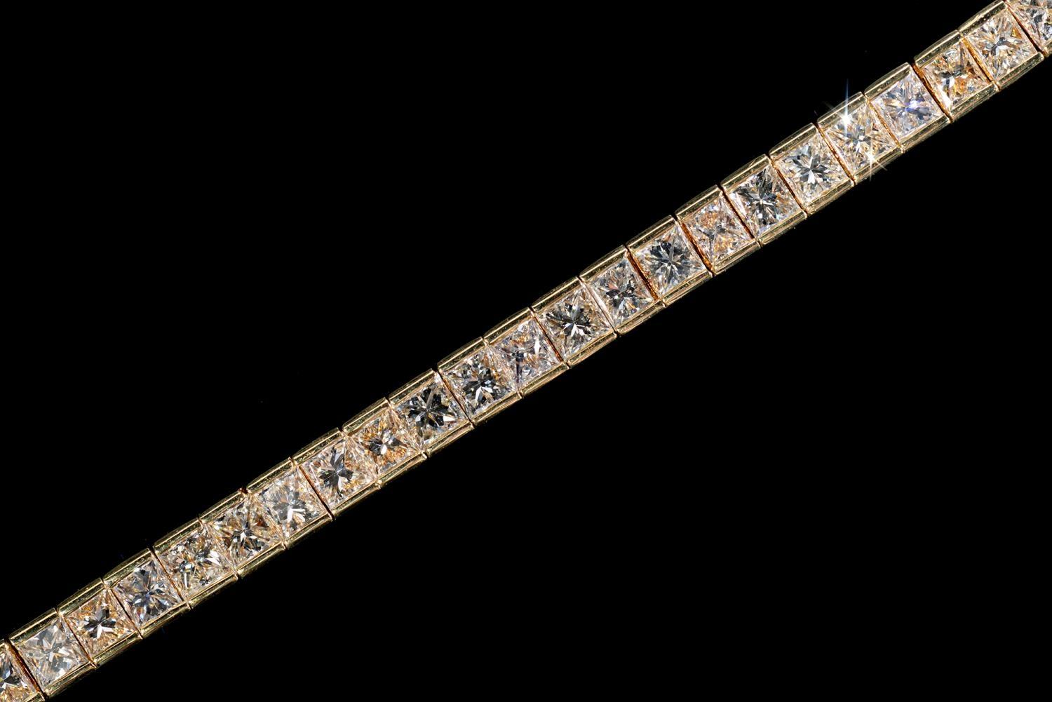 A DIAMOND LINE BRACELET with princess cut diamonds of approx 10ct in total, in gold, 179mm l, marked