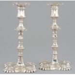A PAIR OF GEORGE III SILVER CANDLESTICKS  with waisted sconce, knopped pillar with nodules and shell
