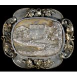 ROYAL.  A PARCEL GILT SILVER BROOCH with cast oblong engraved bas relief view of a schloss, possibly