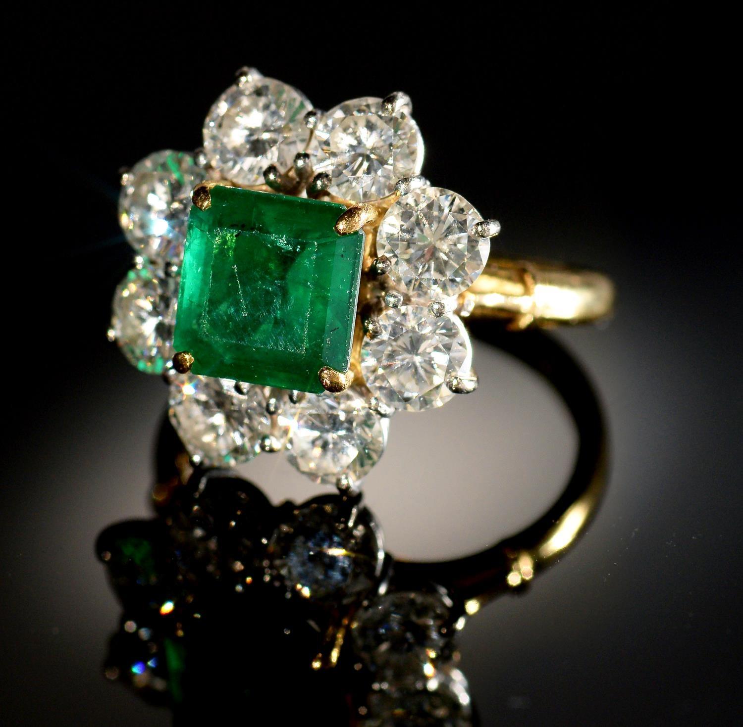 AN EMERALD AND DIAMOND RING,  with step cut emerald of approx 6 x 6mm and of approx 2ct, in a