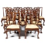 A SET OF TWELVE MAHOGANY DINING CHAIRS, 20TH C with interlaced gothic style splat and carved shell