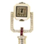 A MODERNIST RUBY, DIAMOND AND WHITE GOLD COCKTAIL WATCH, MID 20TH C with calibre cut rubies, the