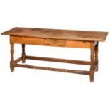 A FRENCH PINE KITCHEN TABLE, 19TH C the boarded top with cleated ends and fitted with a drawer to