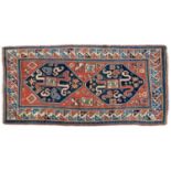 AN ANTIQUE CHONDERESK RUG, 126 x 248cm