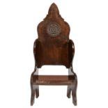 AN OAK WINGBACK CHAIR BY JACK GRIMBLE OF CROMER, NORFOLK, MID 20TH C of adzed boards secured by hand