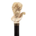 AN EBONY WALKING CANE, PROBABLY FRENCH, LATE 19TH C the ivory handle carved as the head of a