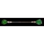 AN ART DECO DIAMOND, NEPHRITE AND WHITE GOLD AND BLACK ENAMEL JABOT PIN, C1930 76mm, marked 18ct,