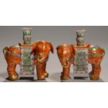 A PAIR OF CHINESE EXPORT PORCELAIN FAMILLE ROSE ELEPHANT INCENSE STANDS, EARLY 19TH C  15.5cm h