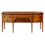 A BREAKFRONT MAHOGANY AND LINE INLAID SIDEBOARD, 19TH C  fitted with drawers with brass lion mask