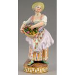 A MEISSEN FIGURE OF A GIRL WITH A BASKET OF FLOWERS, 19TH/20TH C  17cm h, incised C72, crossed