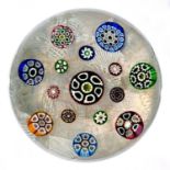 A SPACED  MILLEFIORE PAPERWEIGHT, 19/20TH C  the fifteen canes on muslin ground, pontil scar, 7.
