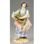 A MEISSEN FIGURE OF A GIRL WITH A BASKET OF FLOWERS, 20TH C  15.5cm h, impressed 36,  81, incised