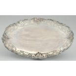 A GEORGE VI SAW PIERCED AND ENGRAVED VINE BORDERED SILVER FRUIT STAND with cast rim, 32cm l, by