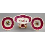 A ROCKINGHAM CLARET GROUND COMPORT AND PAIR OF DESSERT DISHES, C1826-30  of shell and gadroon shape,