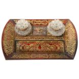 A GEORGE IV BOULLE INKSTAND, C1830 inlaid with cut or pierced brass on a ground of red stained horn,