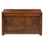 A GEORGE III OAK MULE CHEST, WALES, 18TH C with boarded lid and later carved front, raised and