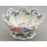 A NOVE MAIOLICA FOOTED OVAL BOWL, 19TH C  painted with flowers and festoons, 16cm h, blue painted