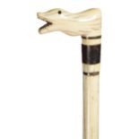 SCRIMSHAW.  AN UNUSUAL WHALEBONE AND WHALE IVORY WALKING CANE, MID 19TH C  the handle carved in
