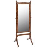 A MAHOGANY CHEVAL MIRROR, C1900  with ring turned frame and brass capped castors, 176cm h, 61cm w