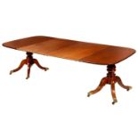 A TWIN PILLAR MAHOGANY DINING TABLE, 19TH C AND LATER  the oblong top with two leaves, on bulbous