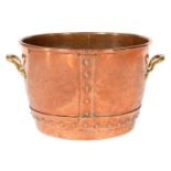 A COPPER LOG BIN, EARLY 20TH C  of riveted construction with rolled rim and brass handles, 43cm diam