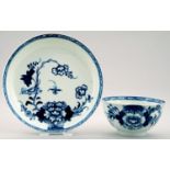A LIVERPOOL BLUE AND WHITE TEA BOWL AND SAUCER, PHILIP CHRISTIAN, C1765-70  painted with the Bird on