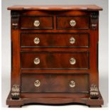 MINIATURE FURNITURE.  A VICTORIAN MAHOGANY CHEST OF DRAWERS, C1870 with moulded glass knobs, 35cm