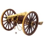 A MODEL CANNON, FIRST HALF 20TH C  the multi stage brass barrel swelled at the muzzle, cast with