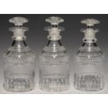 A SET OF THREE ENGLISH CUT GLASS CYLINDRICAL DECANTERS AND STOPPERS, 19TH C   20cm h Polished pontil