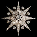 A DIAMOND STAR BROOCH, 20TH C  in the form of an eight pointed star, mounted in gold, 41mm, 15g Good