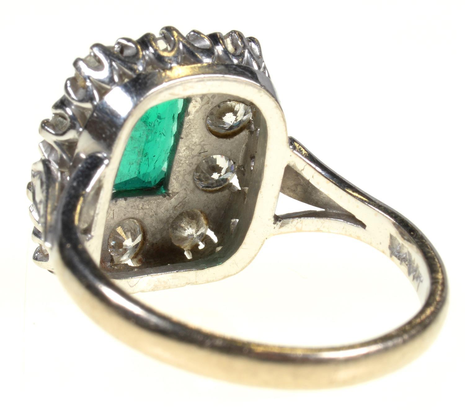 AN EMERALD AND DIAMOND RING  the step cut emerald of approx 4 x 6mm in a surround of ten evenly - Image 4 of 7