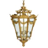 A BRASS HALL LANTERN, 20TH C flared octagonal with festoon mounts and bevelled glass lights, with