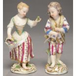 A PAIR OF MEISSEN FIGURES OF BOY AND GIRL FLOWER GATHERERS, C1770  on scrolling gilt mound and