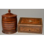 A LAMINATED AND TURNED WALNUT CYLINDRICAL TOBACCO JAR AND COVER, EARLY 20TH C, 19CM H AND A