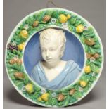 A CANTAGALLI ROUNDEL OF THE HEAD OF A BOY IN THE MANNER OF DELLA ROBBIA, LATE 19TH C, OF