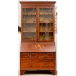 AN EDWARDIAN MAHOGANY BUREAU CABINET, STRING INLAID THROUGHOUT, THE UPPER PART WITH ADJUSTABLE