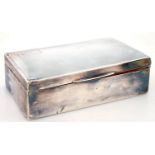 A SILVER CIGARETTE BOX, THE LID ENGINE TURNED, CEDAR LINED, 14.5L, MARKS RUBBED, BIRMINGHAM C.1930