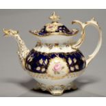 A COALPORT TEAPOT AND COVER, C1835, OF ADELAIDE SHAPE, PAINTED WITH FLOWERS RESERVED ON A COBALT AND