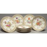 A GERMAN SPIRALLY FLUTED PORCELAIN DESSERT SERVICE, EARLY 20TH C, FREELY PAINTED WITH LOOSE BOUQUETS