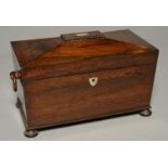 AN EARLY VICTORIAN ROSEWOOD TEA CHEST, C1850, OF SARCOPHAGUS SHAPE WITH RING HANDLES, THE FITTED