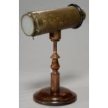 A BREWSTER-TYPE KALEIDOSCOPE, LATE 19TH C, OF GILT TINPLATE, TURNED AND EBONISED WOOD AND BRASS, THE