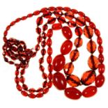A NECKLACE OF RED AMBER (FATURAN) BEADS AND A SIMILAR NECKLACE OF FACETED BEADS (2) Condition report