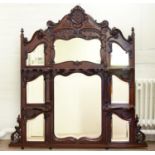 AN EDWARDIAN ROCOCO REVIVAL CARVED MAHOGANY OVERMANTEL MIRROR, C1900, WITH EIGHT BEVELLED GLASS